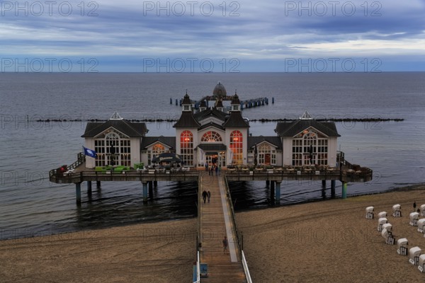 Pedestrians on the pier Sellin at dusk, view from above, long exposure, Baltic resort Sellin, Insel