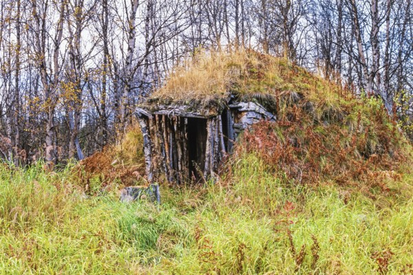 Old Sami goahti built of peat and moss in the forest at autumn in northern Sweden, Lapland, Sweden,