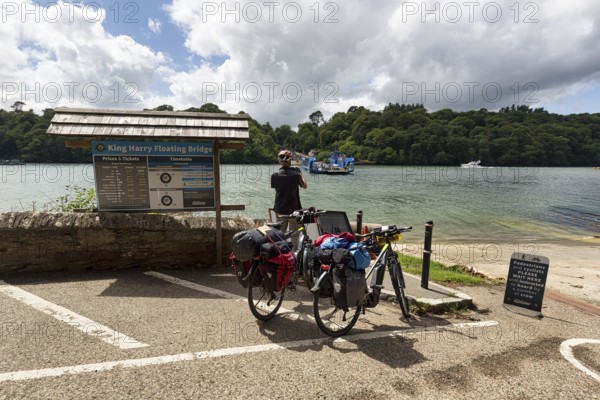 Cyclists, cyclists with e-bikes at the jetty of the King Harry Floating Bridge, chain ferry on