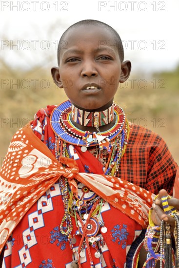 Maasai woman wearing traditional costume, Amboseli National Park, Rift Valley Province, Kenya,