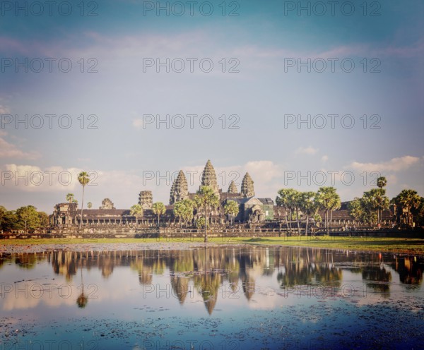 Vintage retro effect filtered hipster style image of Cambodia landmark Angkor Wat with reflection