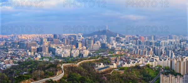 Panorama of Seoul downtown cityscape and Namsan Seoul Tower on sunset from Inwang mountain. Seoul,