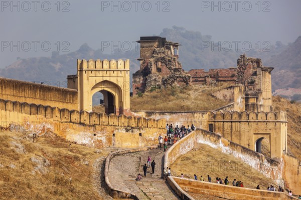 AMER, INDIA, NOVEMBER 18, 2012: Visitors ascending to Amer (Amber) fort. Amer (near Jaipur),