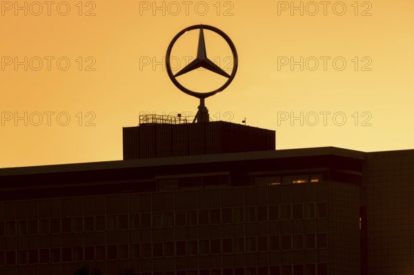 Mercedes star on Mercedes Benz branch in Stuttgart, after sunset, Baden-Württemberg, Germany,