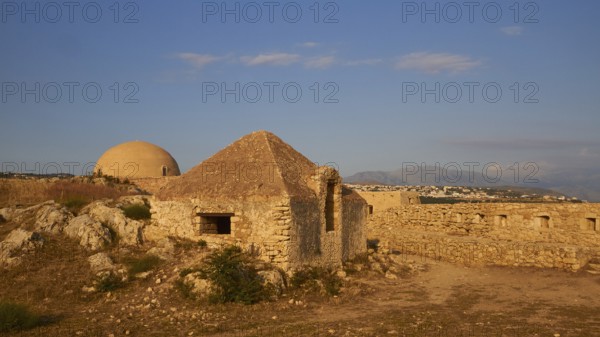 Fortezza, Venetian sea fortress, building inside the fortress, blue sky, few grey-white clouds,