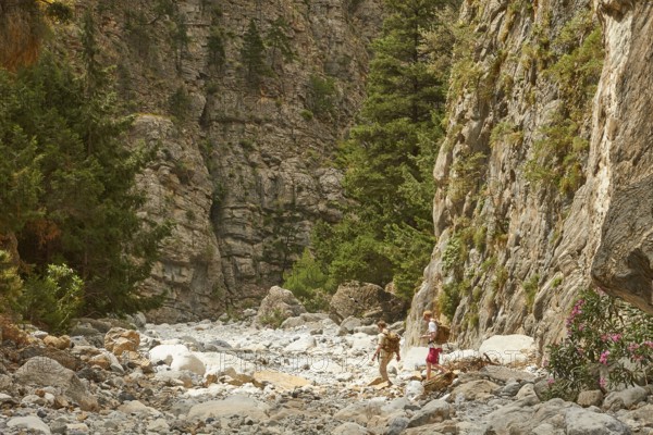 Hiking trail, two hikers with backpacks from behind, Samaria Gorge, Samaria, gorge, national park,
