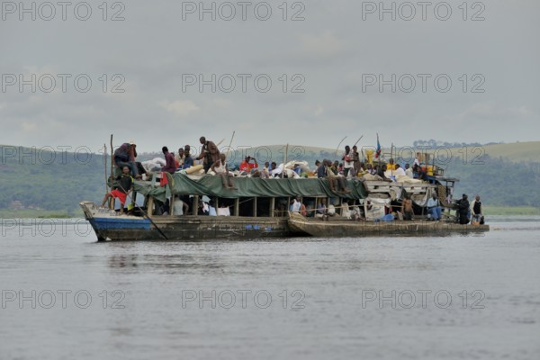 Overloaded boat on the Congo River, near Tshumbiri, Bandundu Province, Congo, Africa