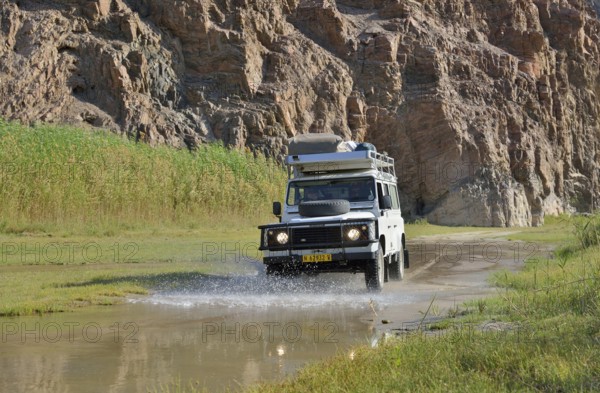 Safari vehicle in the Hoarusib river valley, Purros, Kaokoland, Kunene, Namibia, Africa