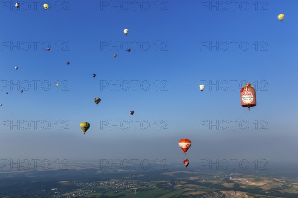 Many different hot air balloons in the blue sky, advertising, logo, hot air balloon festival, 26th
