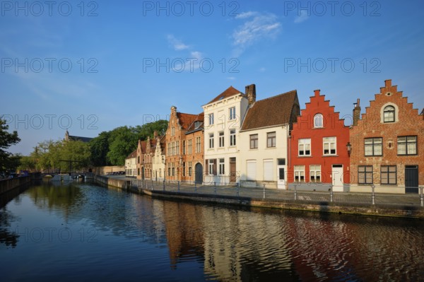 Typical Belgian cityscape Europe tourism concept, canal and old houses on sunset. Bruges (Brugge),