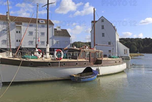 Historic boat and Tide Mill on the waterfront, River Deben, Woodbridge, Suffolk, England, UK