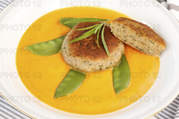 Vegetarian cuisine, walnut cakes on sugar snap peas with pumpkin sauce, sauce, vegetables, snow