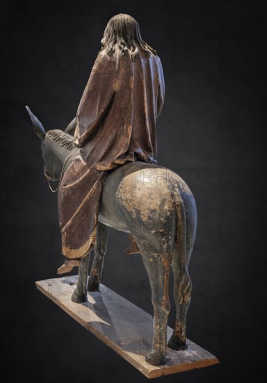 Palm tree donkey, wooden figure from around 1520, on a dark background, Diocesan Museum,