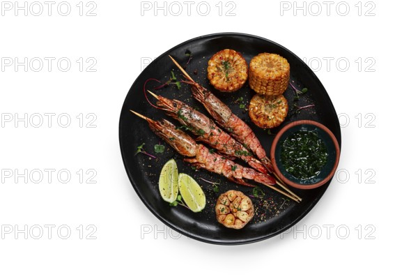 Langoustines on skewers, shrimp kebab, with fried corn, spices and herbs, homemade, no people