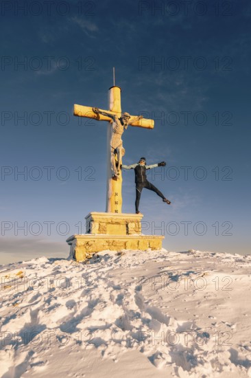 Summit bliss in the snow-covered winter landscape in the Tannheimer Tal in the Alps on the