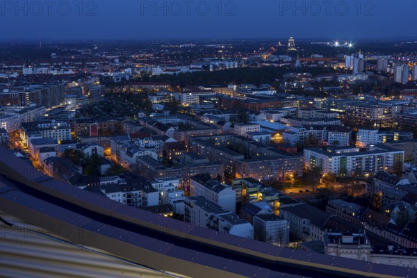 View of the city from the City Tower at blue hour towards the Monument to the Battle of the