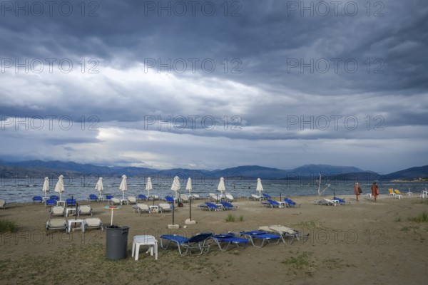 Kalamaki, Corfu, Greece, Sun loungers and parasols on Kalamaki beach in the north-east of the Greek