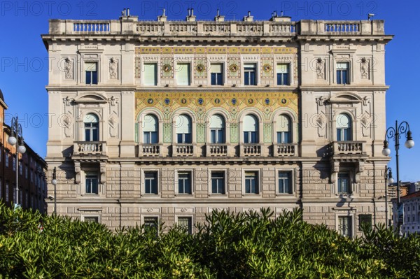 Palazzo del Governo with oriental-looking golden mosaic tiles, Piazza Unità d'Italia in the heart