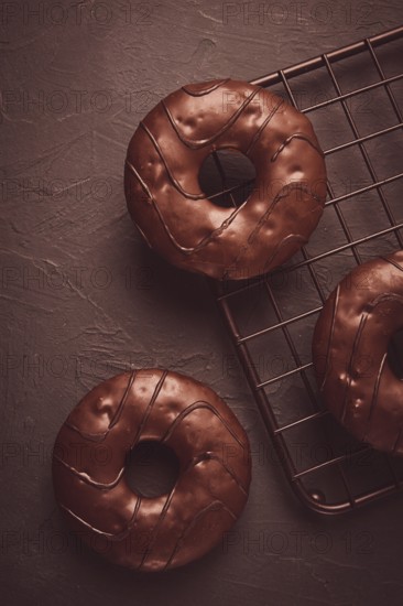 Donuts with cocoa, in chocolate glaze, top view, no people
