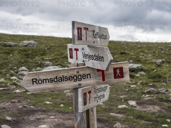 Signpost at trail to mountain ridge Romsdalseggen, famous hiking trip near Andalsnes, Norway,