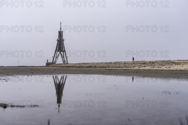Thick fog in winter, hangs over the mouth of the Elbe into the North Sea, navigation mark and
