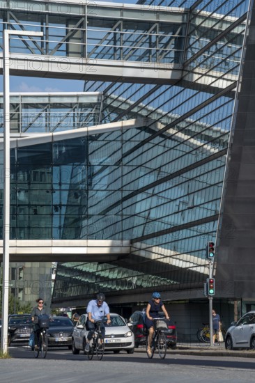 Cyclists on the cycle path on Christians Brygge Street, at the Black Diamond, Danish Royal Library,