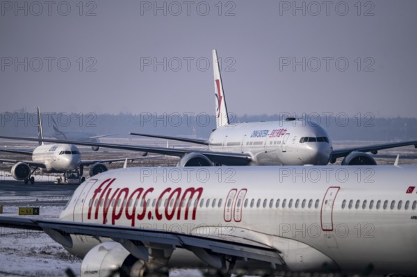 Aircraft on the taxiway at Frankfurt FRA airport, Fraport, in winter, Hesse, Germany, Europe