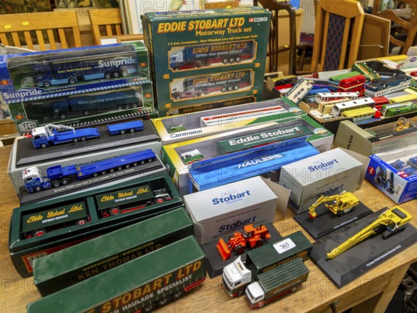Boxes of Eddie Stobart model trucks and other vehicles on display at auction, UK