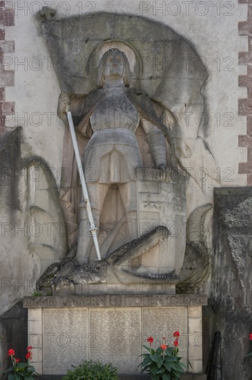 Sculpture of St George with the dragon on a war memorial from both world wars, 1914 to 1918 and