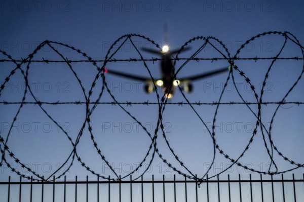 Symbolic image security at the airport, outer fence at Düsseldorf International Airport, steel wire