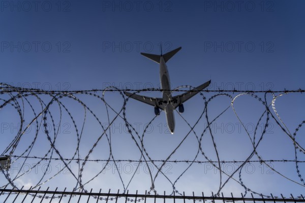 Symbolic image security at the airport, outer fence at Düsseldorf International Airport, steel wire