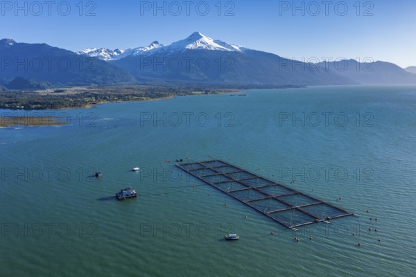 Aerial view of salmon farm in the Reloncavi fjord southeast of Puerto Montt, Chile, South America