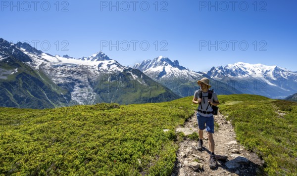 Mountaineer in front of mountain panorama with glaciated mountain peaks, Aiguille de Chardonnet