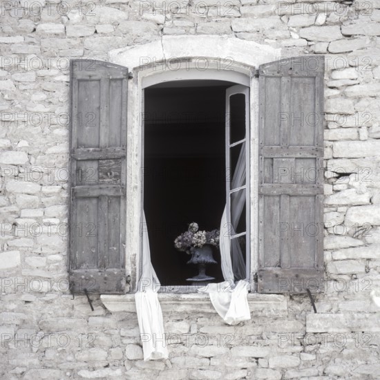 Quarry stone house with open window with shutters, Provence, France, Europe