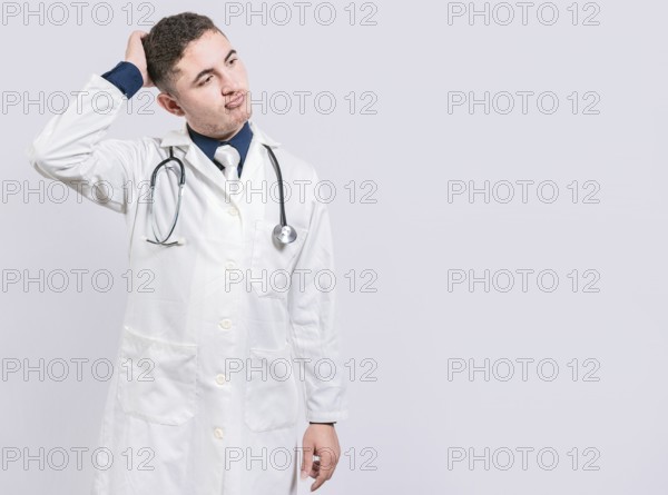 Confused and thoughtful doctor isolated. Uncertain doctor scratching head isolated. Thoughtful