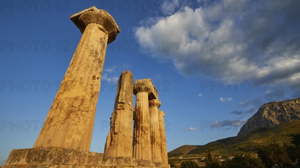 Archaic Temple of Apollo, Doric Columns, Ruins of ancient columns against a vivid blue sky with