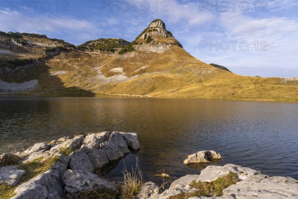 Lake Augstsee and the Atterkogel mountain on the Loser. Rocks in the foreground. Autumn, good