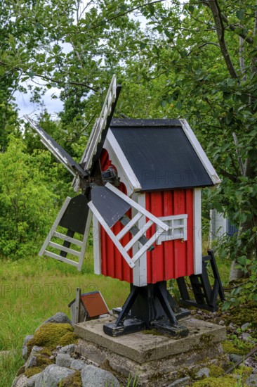 Model of a typical Swedish red windmill in a garden in Blekinge, Sweden, Europe