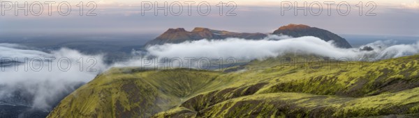 Fog between mountains, moss-covered volcanic mountain landscape, at sunset, Pakgil, Iceland, Europe