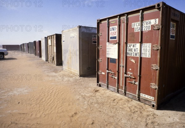 Shipping container with equipment in a storage facility for oil drilling, Dhahran, Arabian Desert,