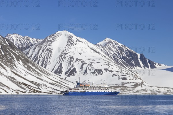 Antarctic cruise ship MV Sea Spirit of Poseidon Expeditions in Magdalenefjorden, fjord in Albert I