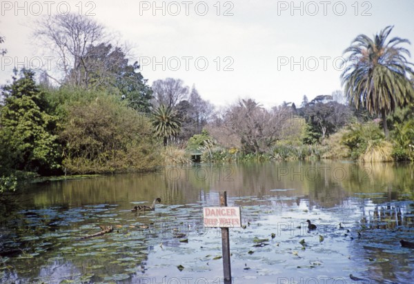 Sign Danger in deep water at the lake in the Royal Botanic Gardens Victoria, Melbourne, Victoria,