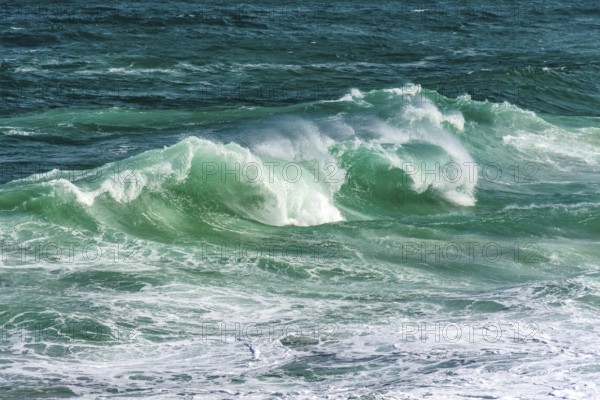 Waves breaking on Ipanema beach on a sunny summer day and the sea with greenish waters, Ipanema