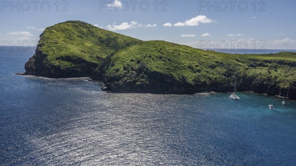 Bird's eye view Aerial view of cape high cliffs steeply rising rocks of Isle de Coin de Mire,