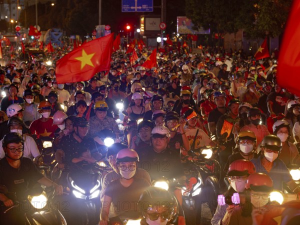 Football fans celebrate in the streets, victory in Asean championship against Thailand, many