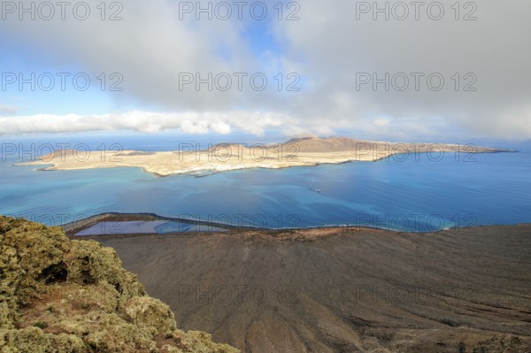 View from Lanzarote to La Graciosa island, largest island in Chinijo archipelago, in between El Rio