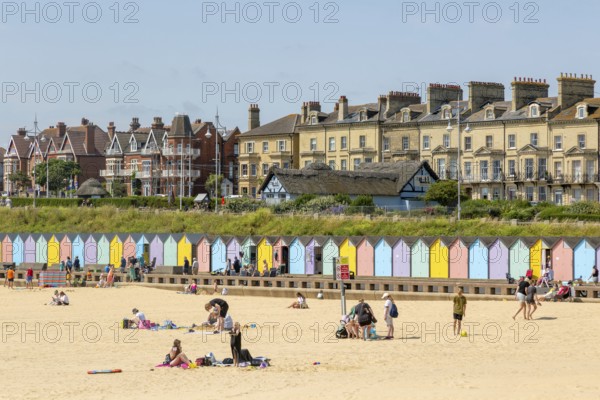 People enjoying sunny weather on sandy South Beach, Lowestoft, Suffolk, England, UK