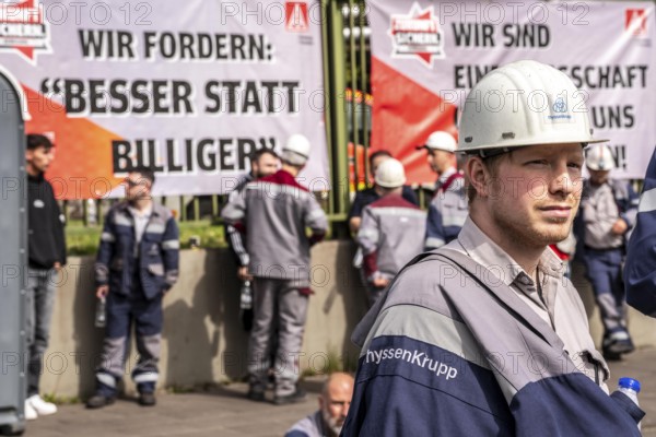 Steelworkers at a demonstration in front of the headquarters of ThyssenKrupp Steel Europe in