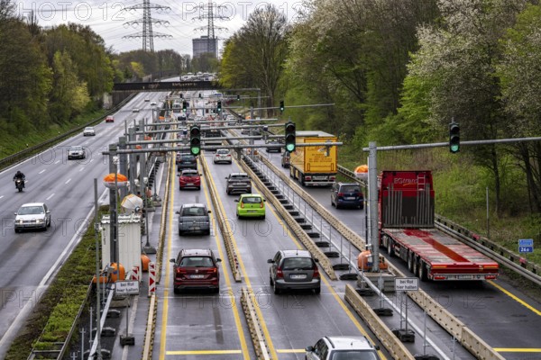 Weighing and barrier system on the A42 motorway, in front of the dilapidated motorway bridge over