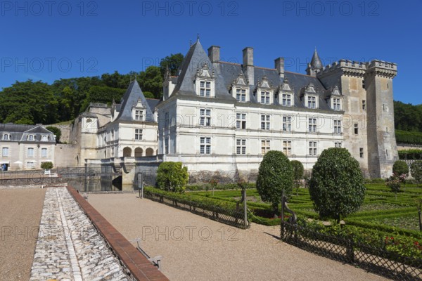 Historic stone castle with manicured green garden on a sunny day, Villandry Castle, Renaissance,